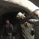 A Free Syrian Army fighter aims his weapon from a defensive position in the old city of Aleppo on Jul. 3, 2013.